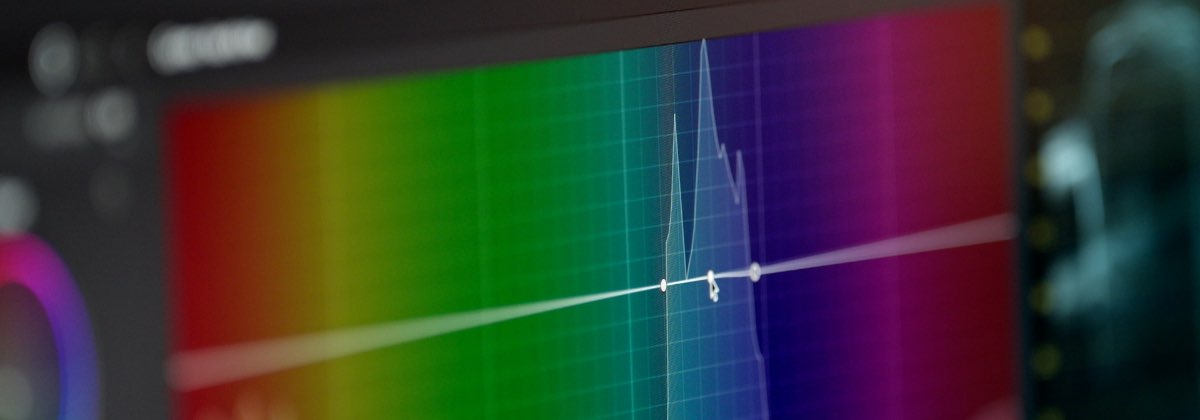 Digital audio workstation showing EQ curves and volume faders