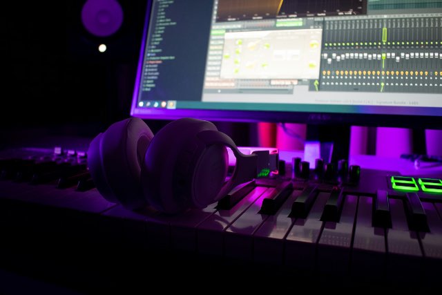 Studio headphones resting on a mixing desk for critical listening