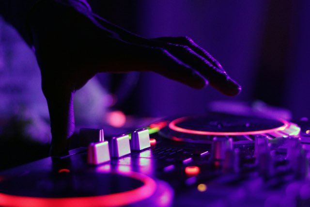 Close up of a DJ mixer crossfader