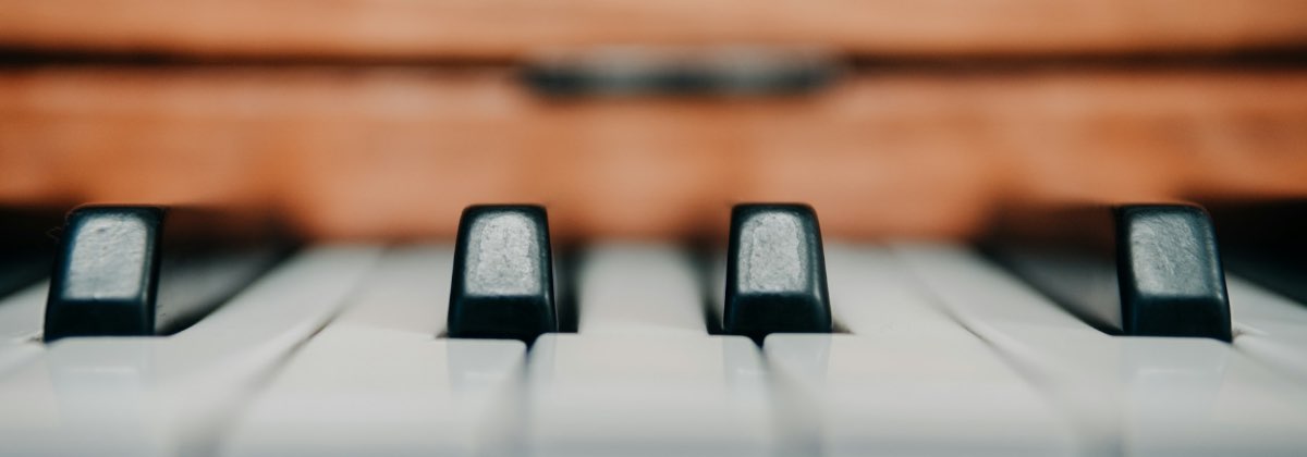 A close-up of a piano keyboard used to map vocal pitches to musical notes