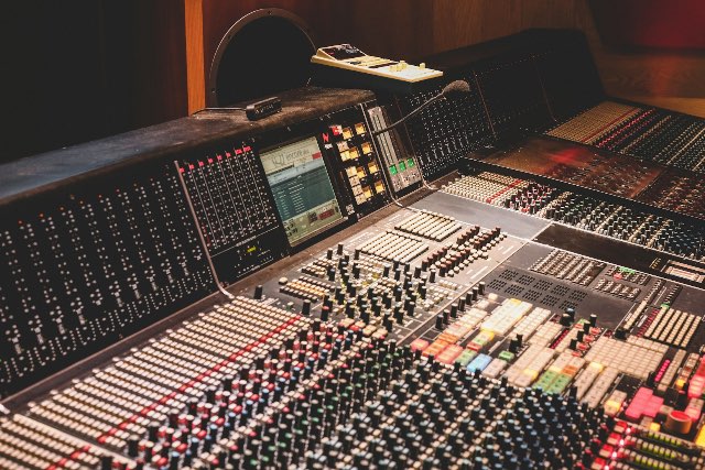 Adjusting audio pitch and speed on a studio mixing console