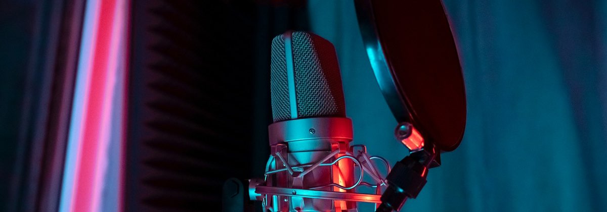 Vocalist in a recording booth applying tempo synced reverb and delay